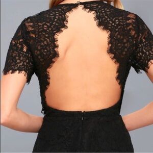 Ladies' size S black lace blouse. Back out